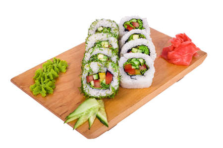 A composition of vegetable sushi on a wooden boardの写真素材