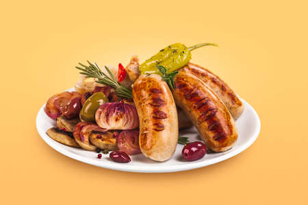 dish of fried sausage with black olives and mushroomsの写真素材