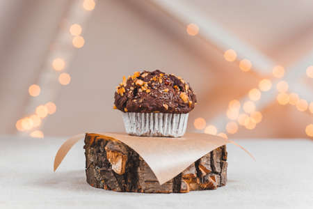chocolate cake with nuts on the table and bokehの写真素材