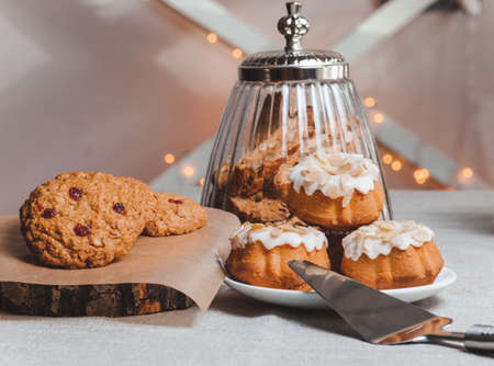 objects on sackcloth bank and cookies with nuts and cupcake with a spoonの写真素材