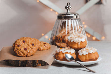 objects on sackcloth bank and cookies with nuts and cupcake with a spoonの写真素材