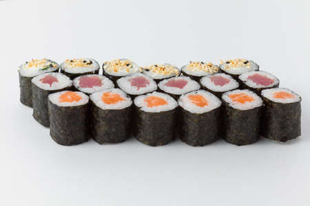 Sushi rolls with sesame seeds, tuna and salmonの写真素材