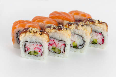 sushi rolls on a white background with salmon, caviar crab and sesame seedsの写真素材