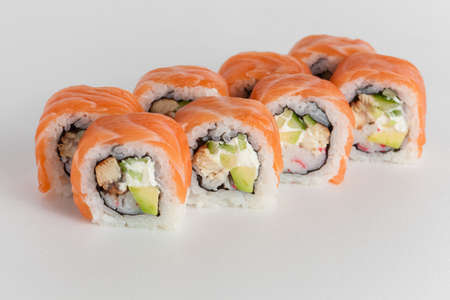 Sushi rolls with salmon and cheese on white backgroundの写真素材