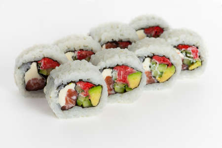 Sushi rolls with fish and cheese on a white backgroundの写真素材