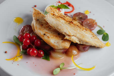 Chicken fillet with grapes and currant closeupの写真素材