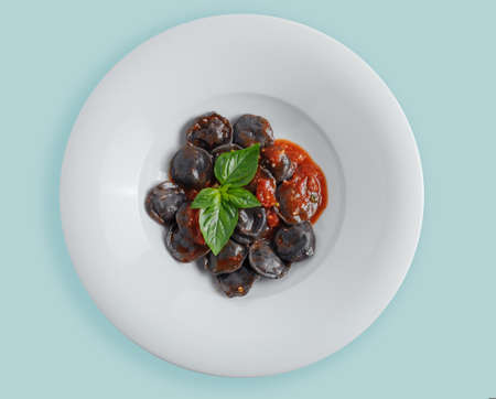 black cuttlefish ink dumplings on a white background top viewの写真素材