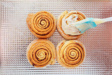 Stack of freshly cinnabon, French buns with cinnamon and creamの写真素材