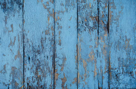 Texture of old wood with peeling old blue paint, old fence. Background for banner.の写真素材