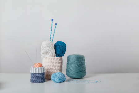 composition of threads and rollers on a white background. Knitting kitの写真素材