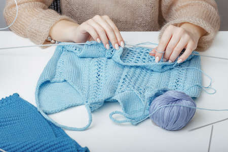 the process of creating knitted clothes for shop