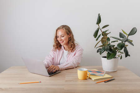 A young girl studies and works at homeの写真素材