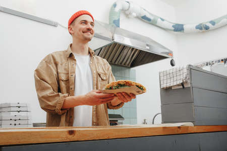 man cooking italian street food on the kitchenの写真素材