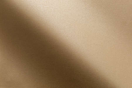 Gradient fold on shiny fabric with fine texture metallic hueの写真素材