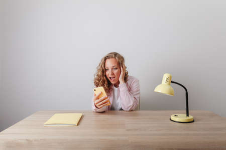 The girl received terrible news on the phoneの写真素材