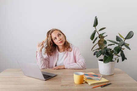 A young girl studies and works at homeの写真素材