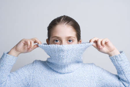 Portrait of the girl in sweater with big collarの写真素材