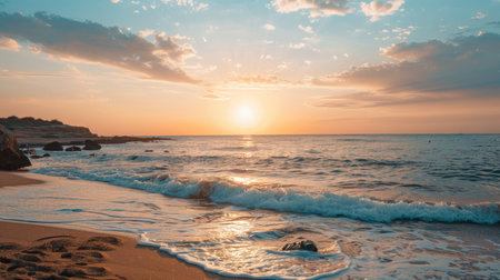 Beautiful sunset on the beach. The sun goes down over the sea.の素材