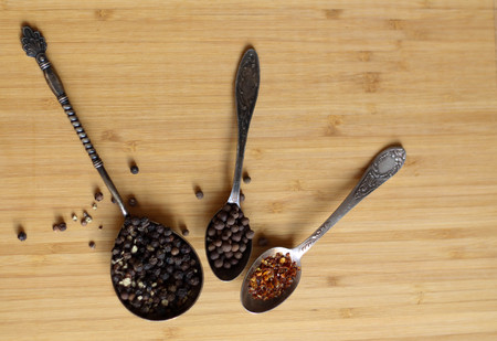 Ingredients. Different spices, pepper on three spoonsの写真素材
