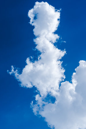 White clouds in the blue skybe used as background.の写真素材