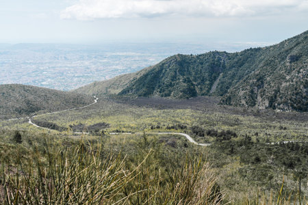 Naples, Italy - 04.28.2025: Mountain road to a parking lot below near Mount Vesuvius on the...