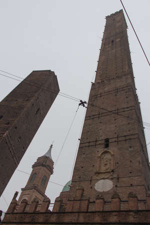 Italy, Bologna - November 19 2016: the view of the Asinelli tower 97 m and Garisenda tower 48 m. in the fog on November 19 2016 in Bologna, Emilia Romagna , Italy.のeditorial素材