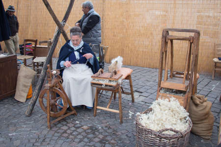Italy, Bologna - November 20 2016: knitter women on their work on market on November 20 2016 in Bologna, Emilia Romagna , Italy.のeditorial素材