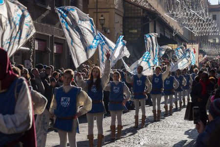 Italy, Florence - January 6 2017: the view of flag-bearers in medieval cotume at the tradition...