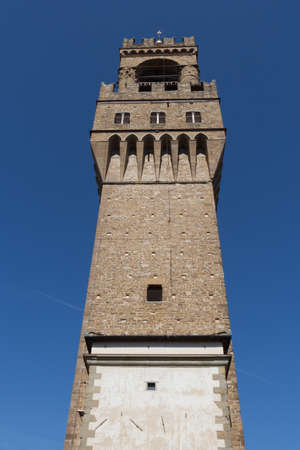 Italy, Florence - May 18 2017: the back view of the Arnolfo Tower of Palazzo Vecchio on May 18 2017 in Florence, Tuscany, Italy.のeditorial素材