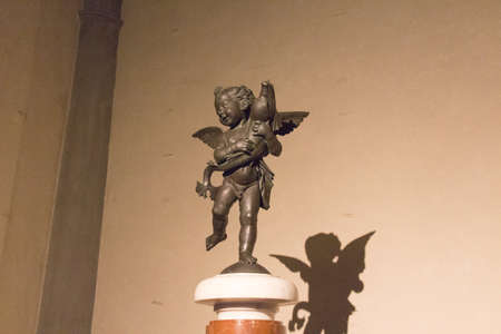 Italy, Florence - May 18 2017: the view of the Putto with dolphin, statue by Andrea del Verrocchio in the Terrace of Juno at Palazzo Vecchio on May 18 2017 in Florence, Italy.のeditorial素材