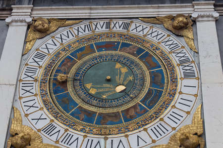 Italy, Brescia - October 01 2017: the view of the clock tower with historical astronomical clock at Piazza Loggia on October 01 2017, Lombardy, Italy.のeditorial素材