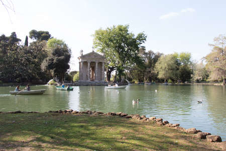 Italy, Rome - April 15 2017: the view of lake and Temple of Aesculapius in the Villa Borghese Gardens on April 15 2017, Lazio, Italy.のeditorial素材