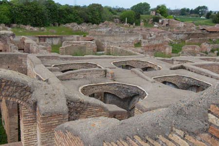 Italy, Ostia - April 16 2017: the view of Caseggiato degli Aurighi in The Ancient Roman Port of Ostia Antica on April 16 2017, Lazio, Italy.のeditorial素材
