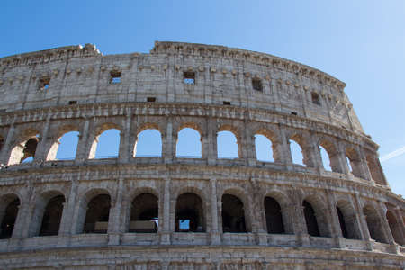 Italy, Rome - April 17 2017: the detailed view of Colosseum with blue sky on background on April 17 2017, Lazio, Italy.のeditorial素材