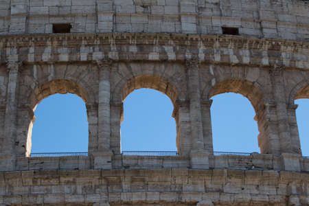 Italy, Rome - April 17 2017: the detailed view of Colosseum with blue sky on background on April 17 2017, Lazio, Italy.のeditorial素材