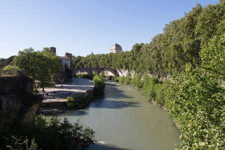Italy, Rome - April 17 2017: the view of Tiber river and Tiber island seeing from Palatine bridge on April 17 2017, Lazio, Italy.のeditorial素材