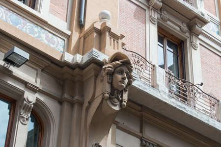 Italy, Florence - May 18 2017: the view of woman face, carved out of stone, in decorating of the building on Via del Campidoglio on May 18 2017 in Florence, Italy.のeditorial素材