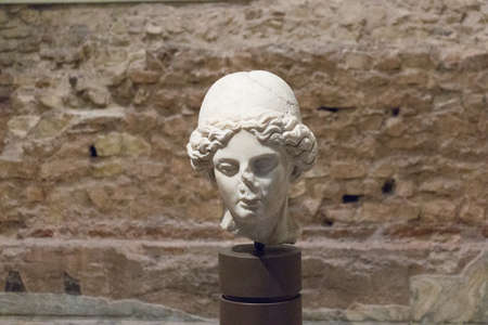 Italy, Brescia - December 24 2017: the view of the copy of I-II century A.D. sculpture Minerva's head in the Capitolium archaeological area on December 24 2017 in Brescia, Lombardy, Italy.のeditorial素材