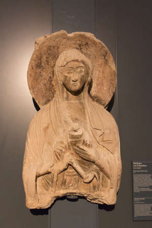 Italy, Brescia - December 24 2017: the view of Madonna and child painted stucco IX century in Santa Giulia museum on December 24 2017 in Brescia, Lombardy, Italy.のeditorial素材