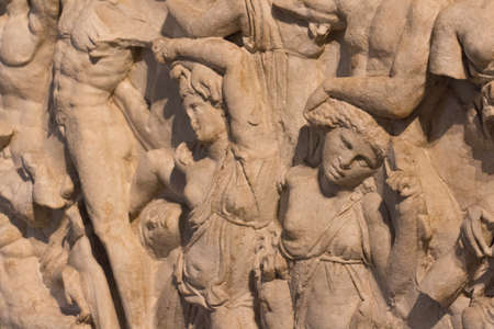 Italy, Lombardy - December 24 2017: the view of the front side of attic sarcophagus 2nd-3d century A.D., The battle of the Amazons, in Santa Giulia museum on December 24 2017 in Brescia, Lombardy, Italy.のeditorial素材