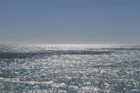 The view of horizon line over sea in a sunny day.