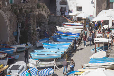 Riomaggiore, Italy - April 1 2018: the view of boats on a street of fisherman village Riomaggiore in the National Park of Cinque Terre on April 1 2018 in Liguria Italy.のeditorial素材