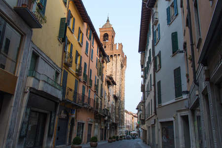 Brescia, Italy - August 1 2018: the view of the Corso Giuseppe Garibaldi with Torre della Pallata on background on August 1 2018, Lombardy, Italy.のeditorial素材