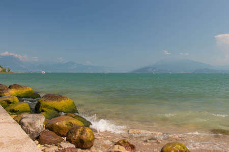 The view of Garda Lake with mountains on background, Lombardy, Italy.の写真素材