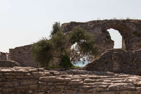 Italy, Lombardy - August 05 2018: the view of roman ruins Grotte di Catullo with Lake garda on background on August 05 2018 in Sirmione, Italy.のeditorial素材