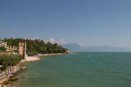 Italy, Lombardy - August 05 2018: the view of Sirmione Old Town on the edge of Lake Garda on August 05 2018 in Sirmione, Italy.のeditorial素材