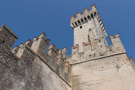Italy, Lombardy - August 05 2018: the view of the Scaliger Castle tower on August 05 2018 in Sirmione, Italy.のeditorial素材