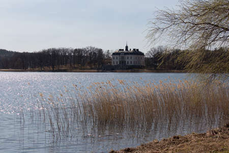 Mariefred, Sweden - April 20 2019: the exterior view of white building by the lake Malaren on April 20 2019 in Mariefred, Sweden.のeditorial素材