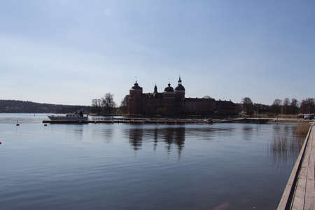 Mariefred, Sweden - April 20 2019: the view of Gripsholm Castle and pier in a sunny day on April 20 2019 in Mariefred, Sweden.のeditorial素材