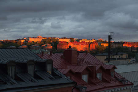Sweden, Stockholm - May 26 2019: the view of downtown at sunset light with heavy clouds on background on May 26 2019 in Stockholm, Sweden.のeditorial素材